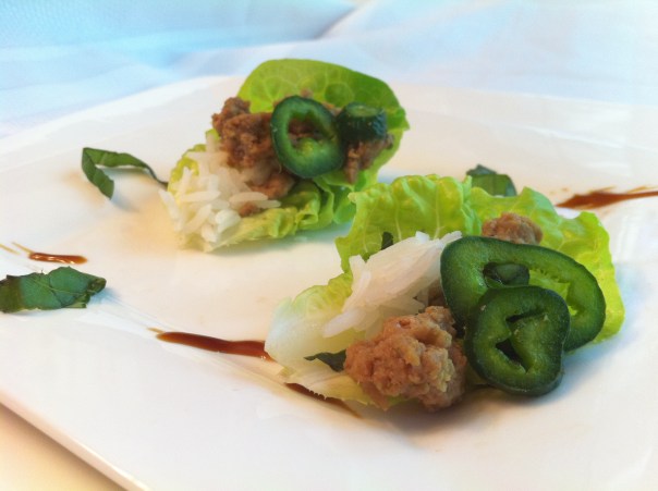 Mini Thai Basil Turkey Lettuce Cups with Garnishes of Jasmine Rice, Poblano Pepper, Oyster Sauce & Chiffanade of Basil.